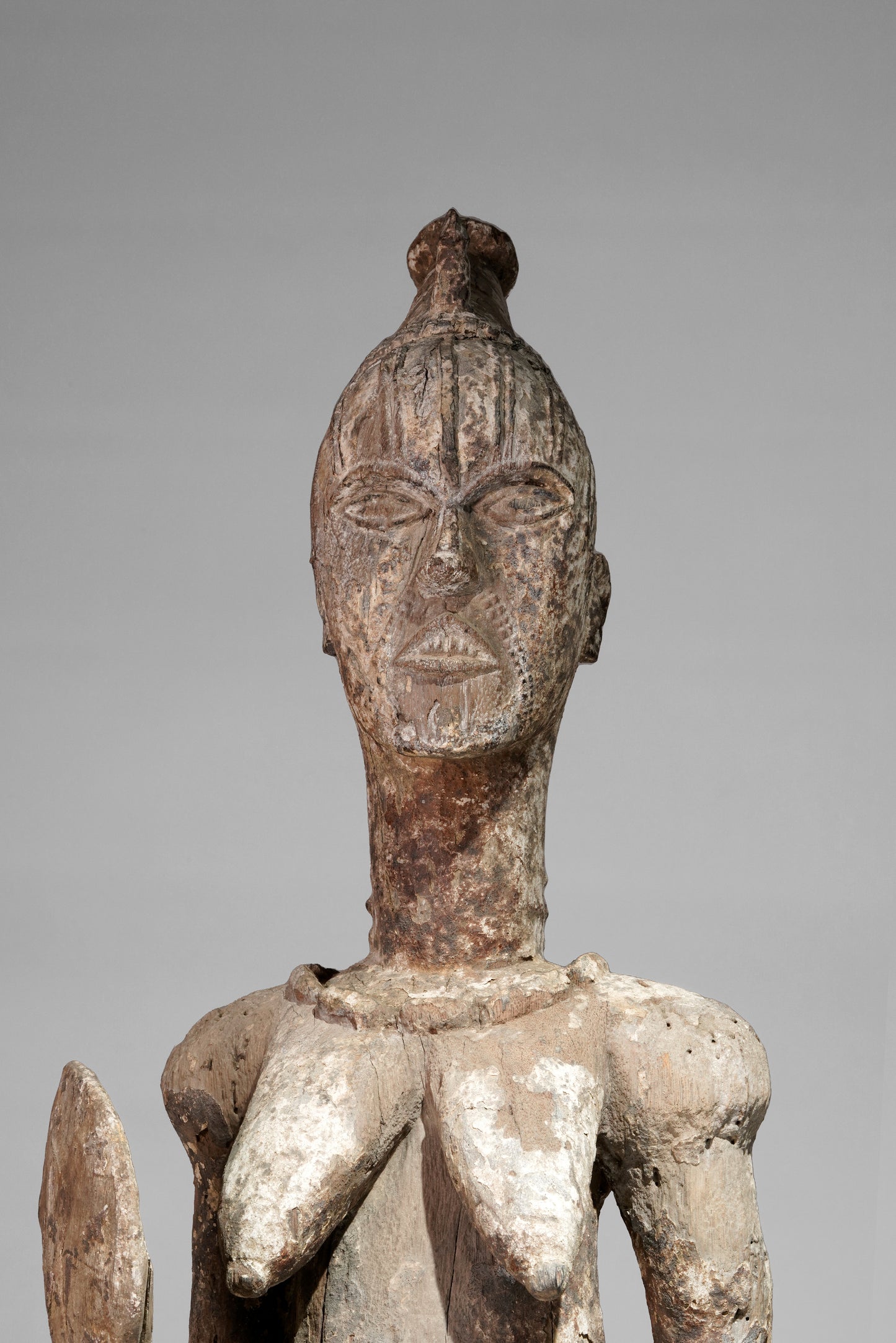 A very expressive female seated Urhobo sculpture