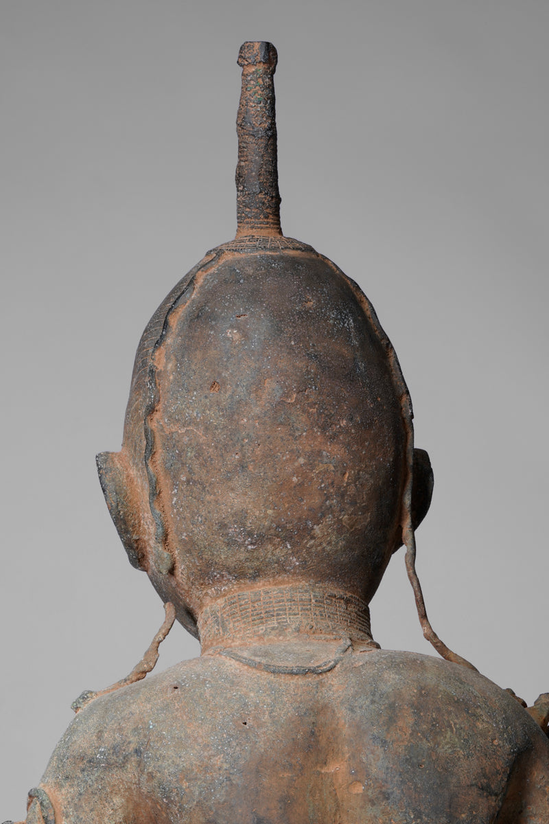 A fragmentary bronze sculpture