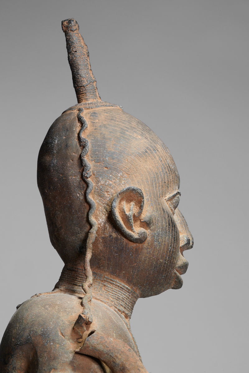 A fragmentary bronze sculpture