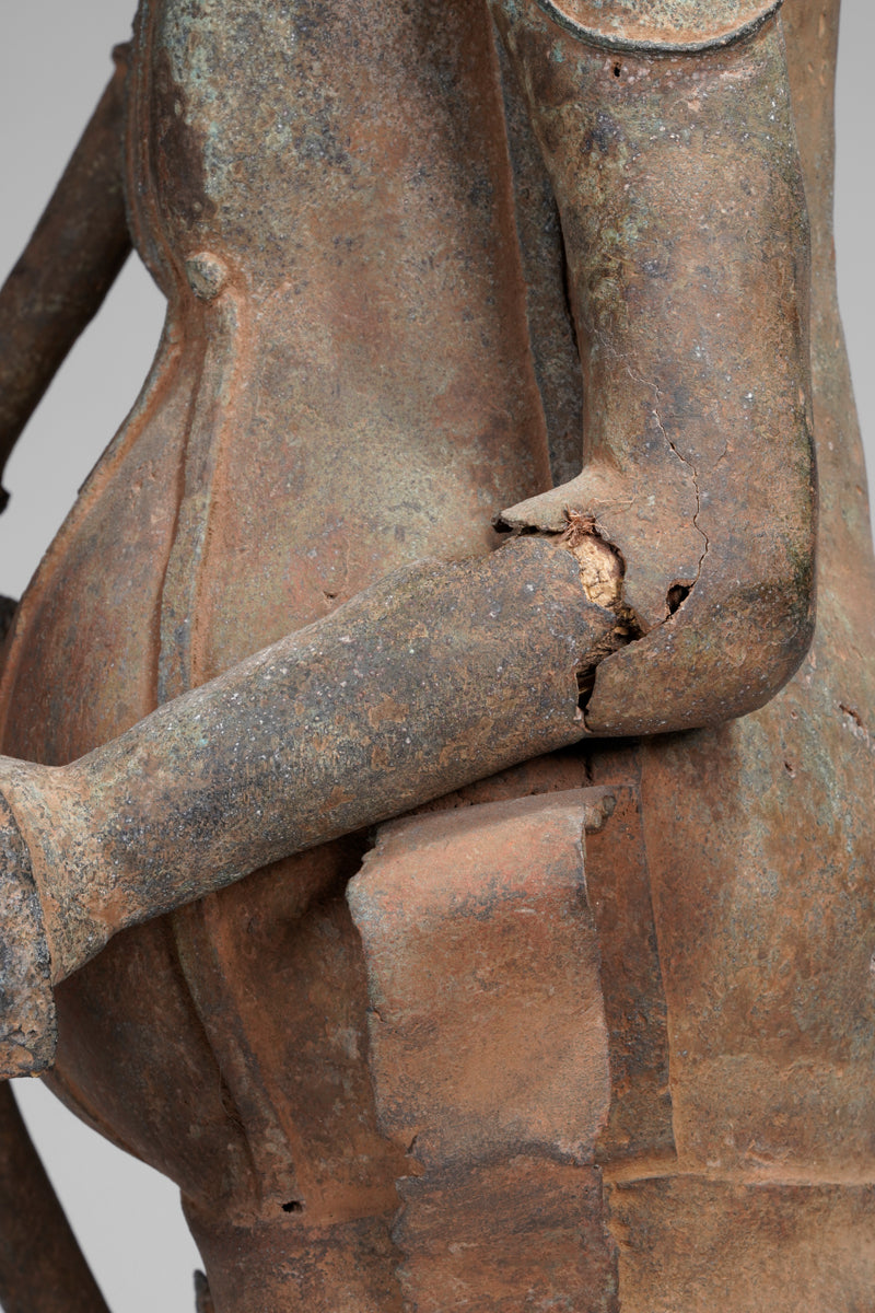 A fragmentary bronze sculpture