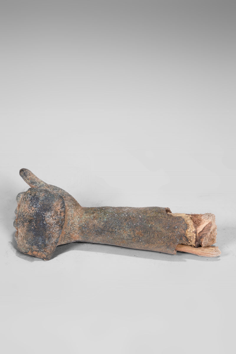 A fragmentary bronze sculpture