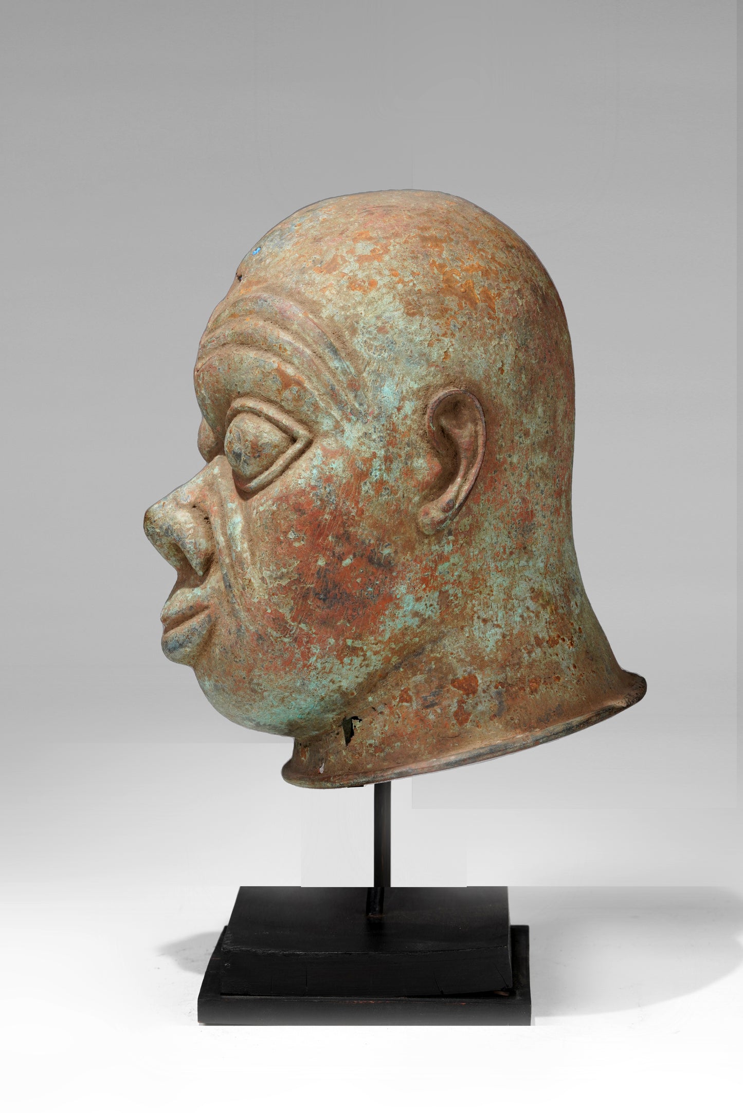 A bronze head in the style of Tada