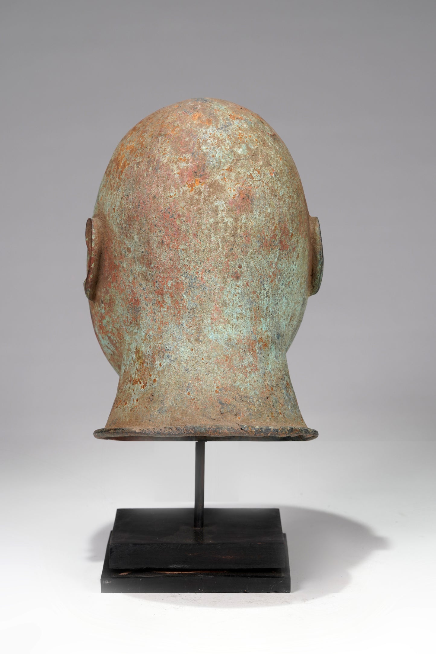 A bronze head in the style of Tada