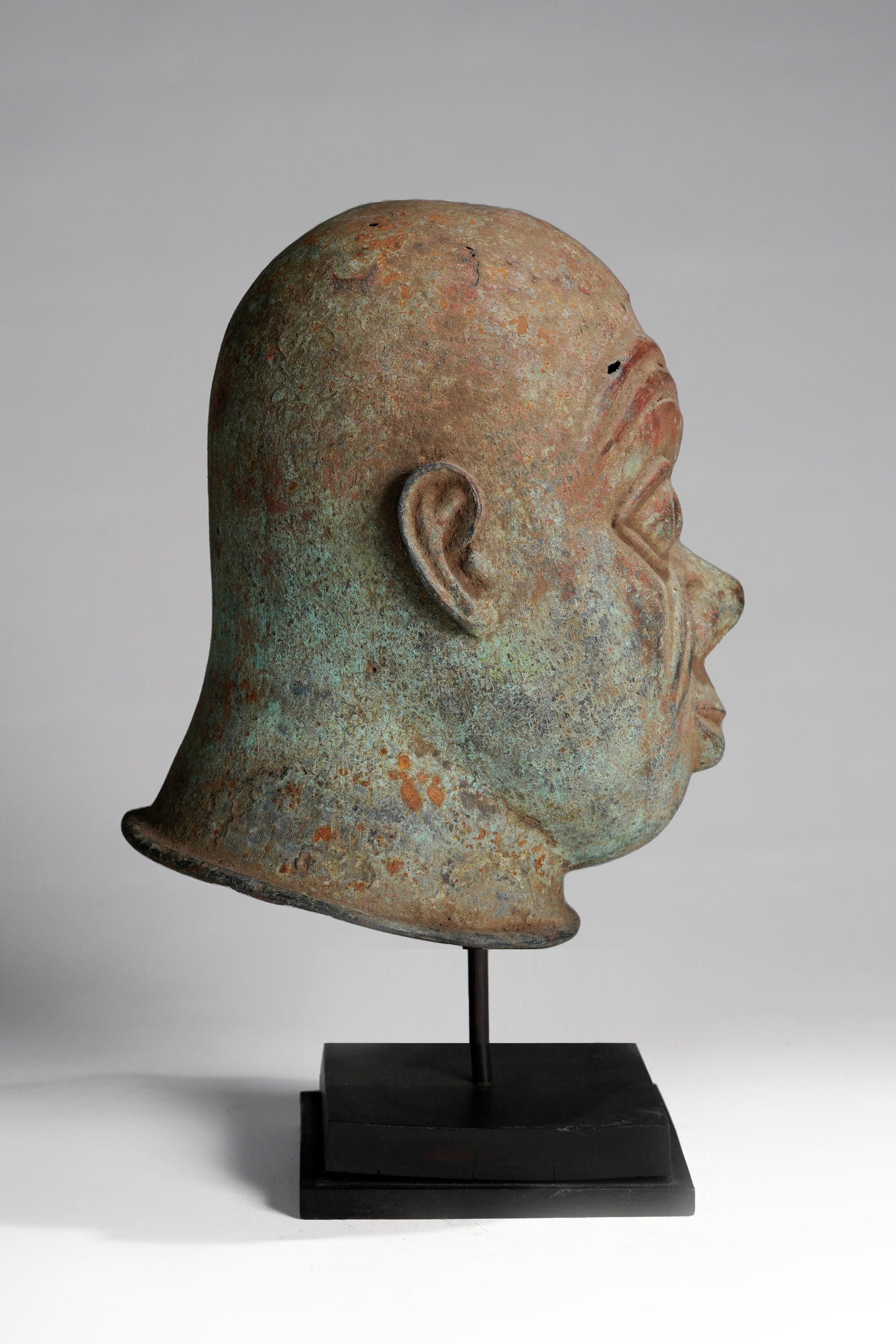 A bronze head in the style of Tada