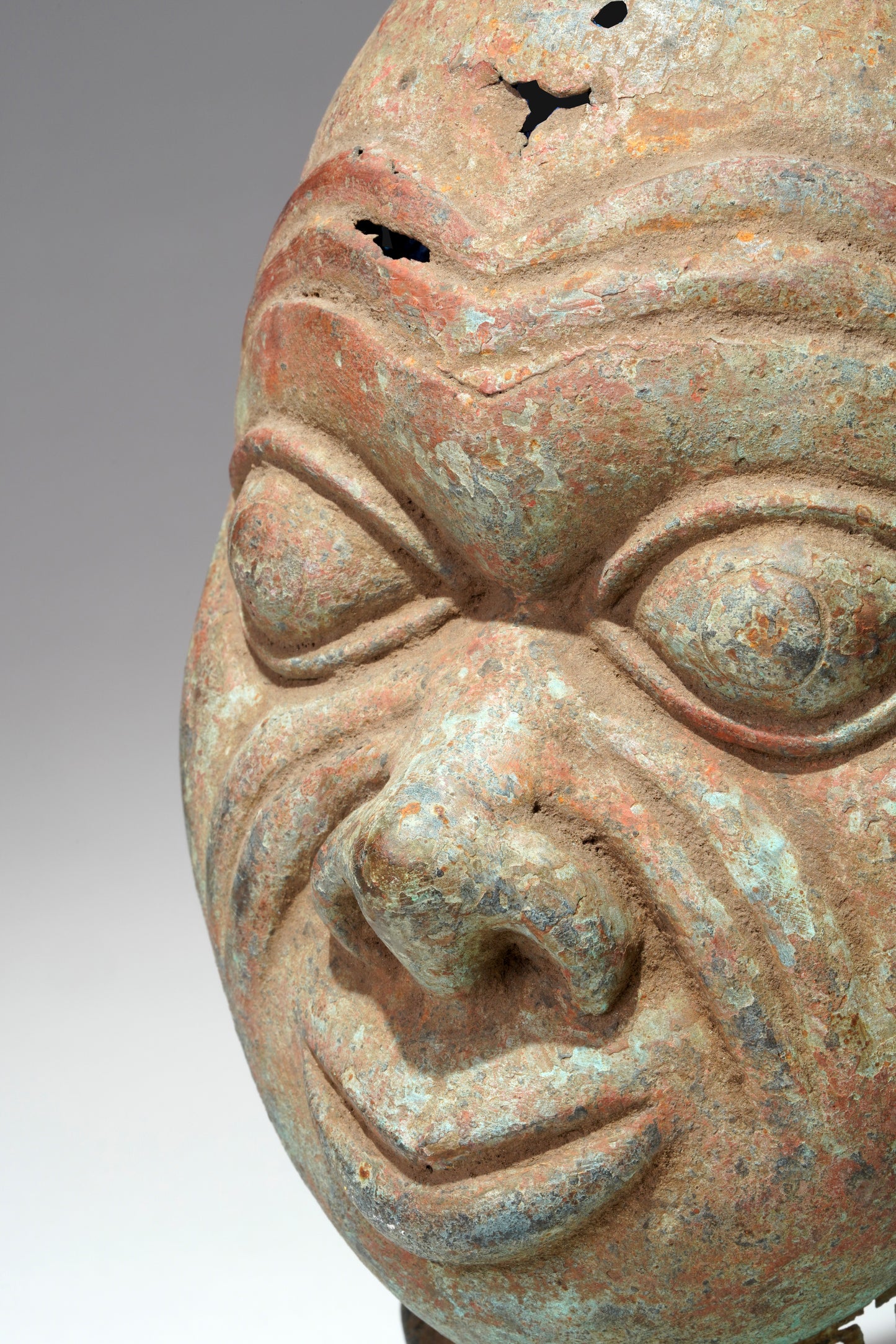 A bronze head in the style of Tada
