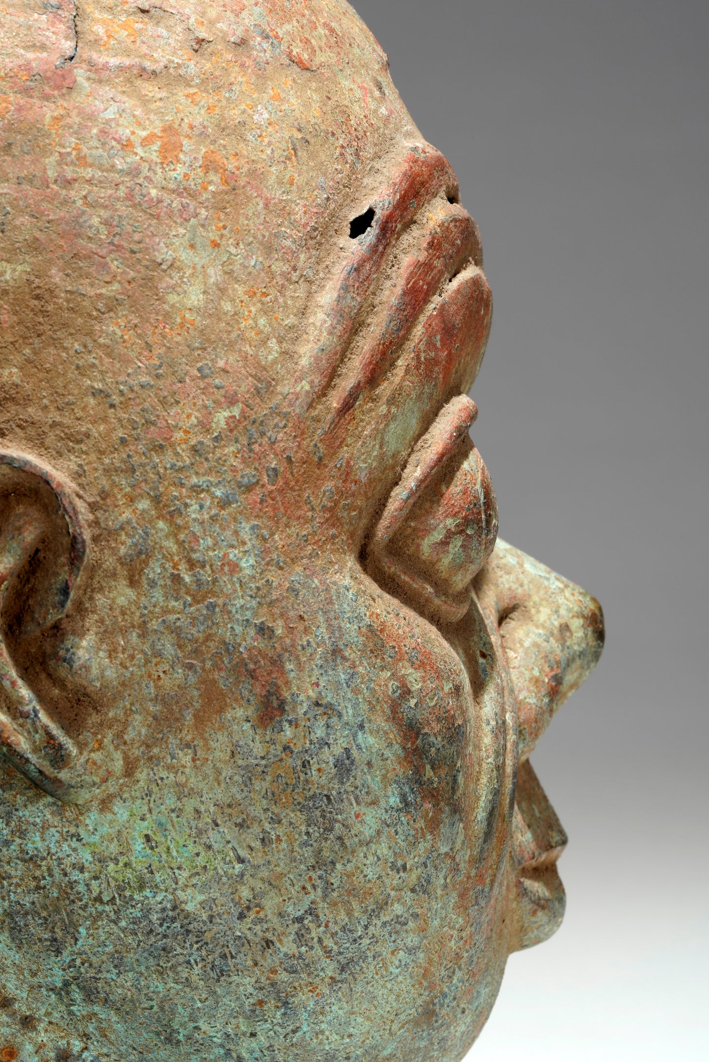 A bronze head in the style of Tada