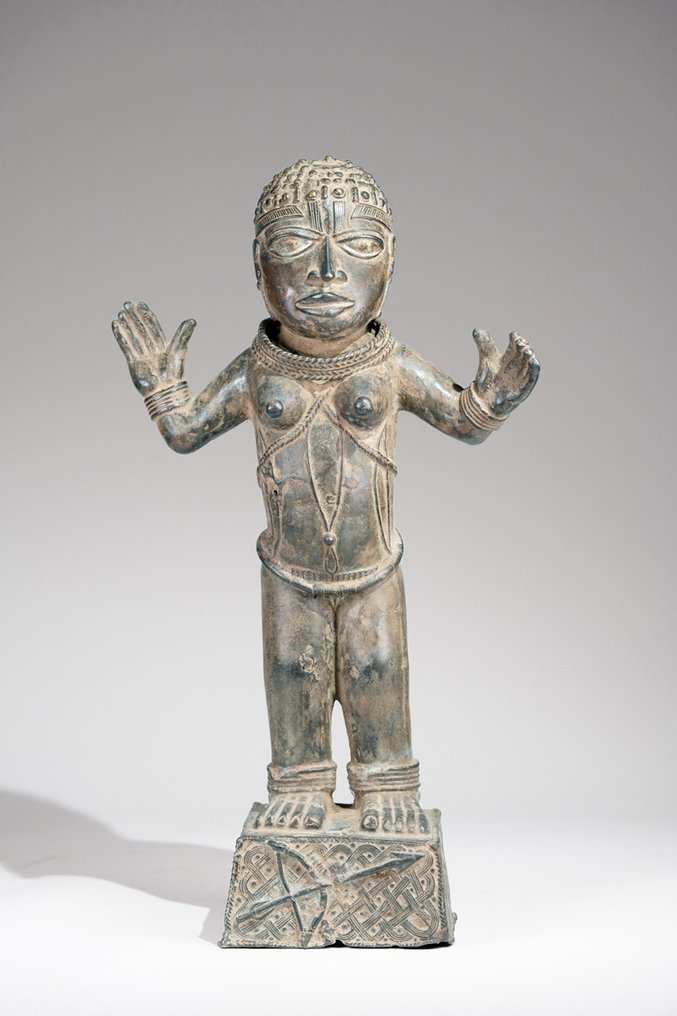 A female Bronze sculpture, in the style of Benin