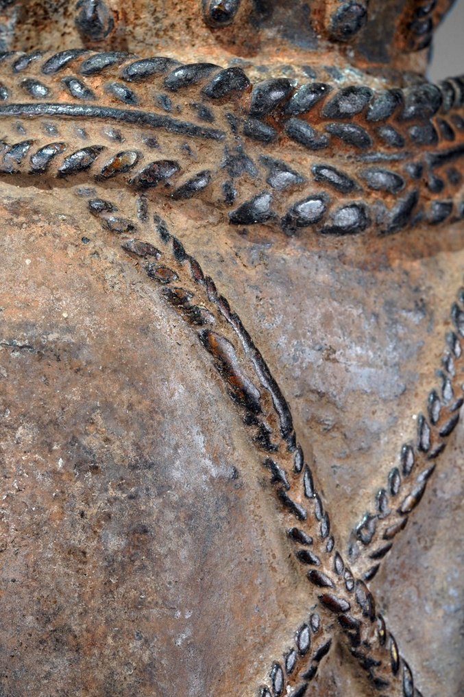 A female Bronze sculpture, in the style of Benin