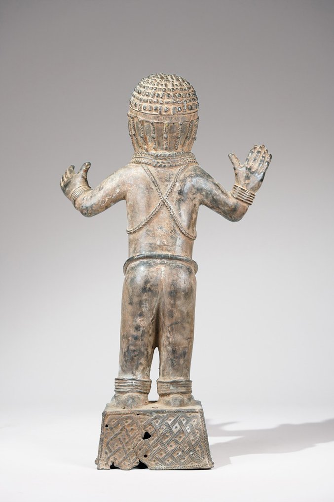 A female Bronze sculpture, in the style of Benin