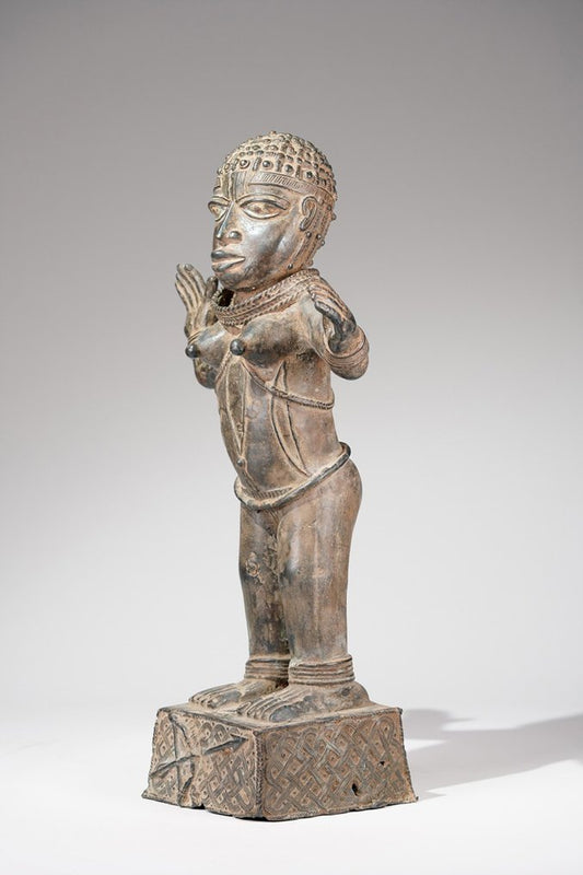 A female Bronze sculpture, in the style of Benin