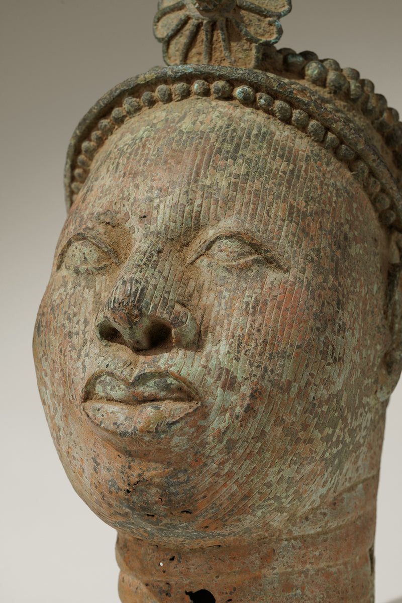 A crowned bronze head of Olokun