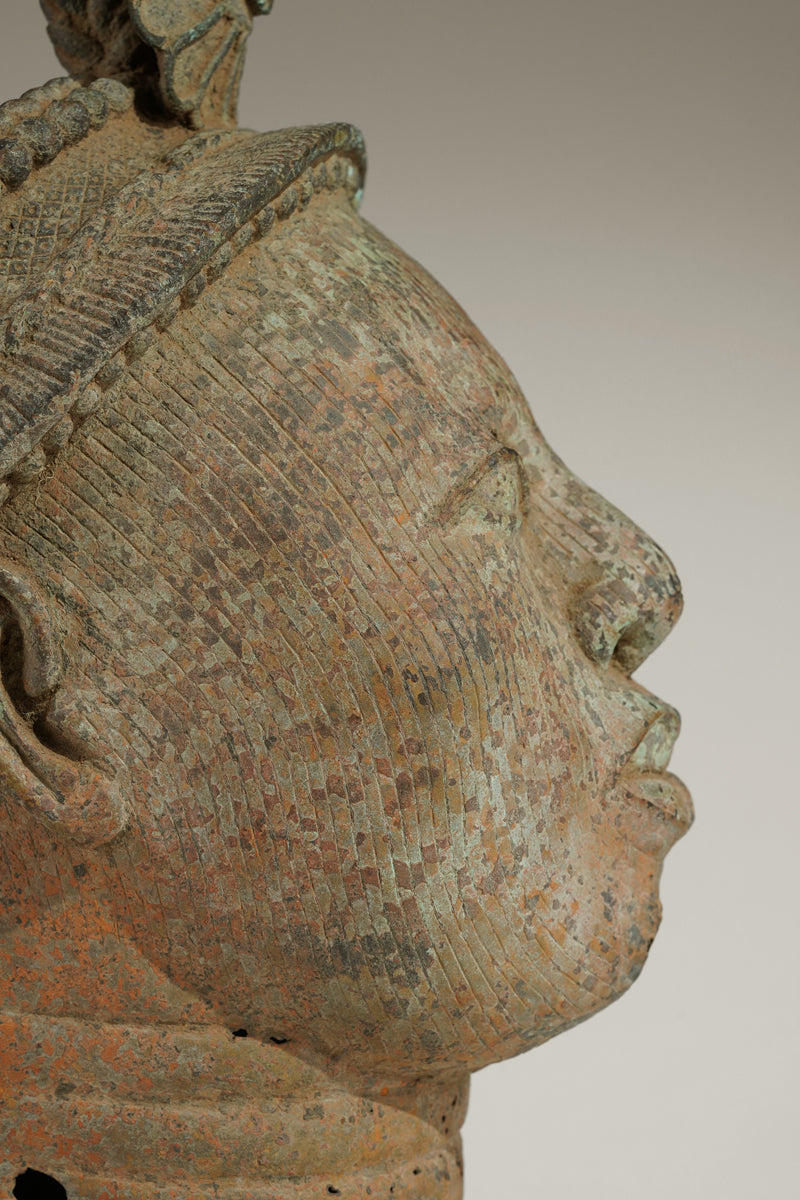 A crowned bronze head of Olokun