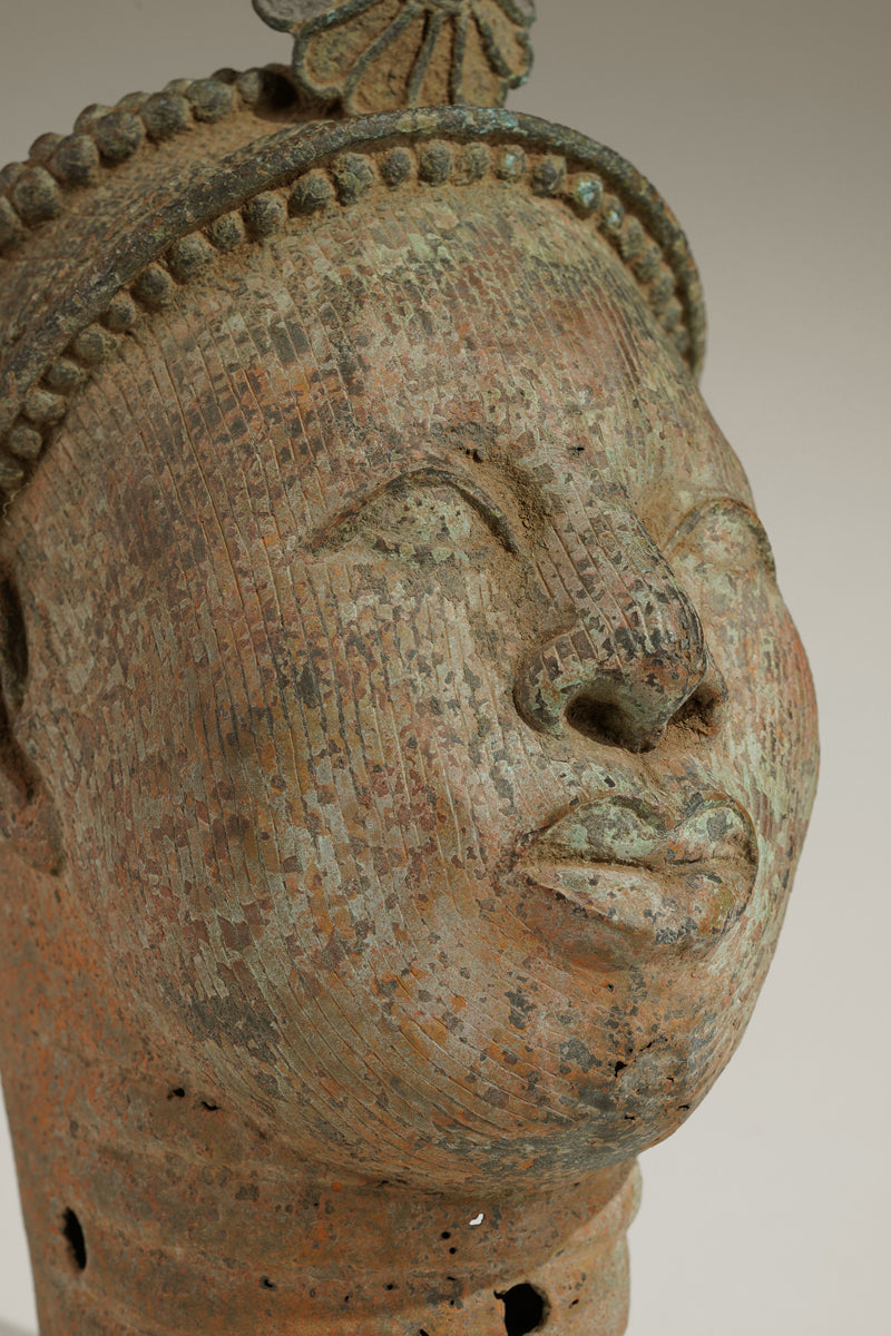 A crowned bronze head of Olokun