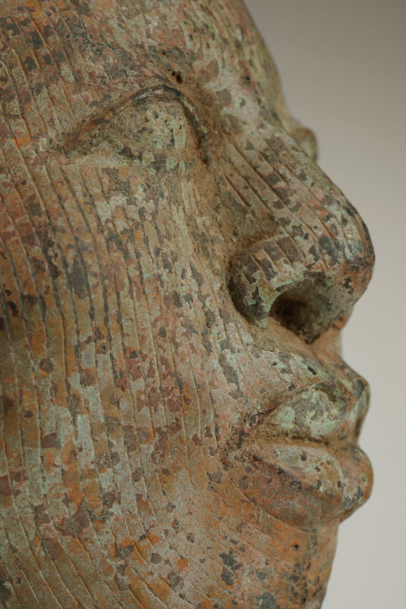 A crowned bronze head of Olokun