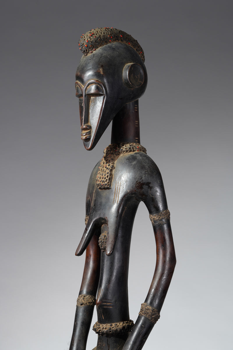 A female Senufo Rhythm pounder