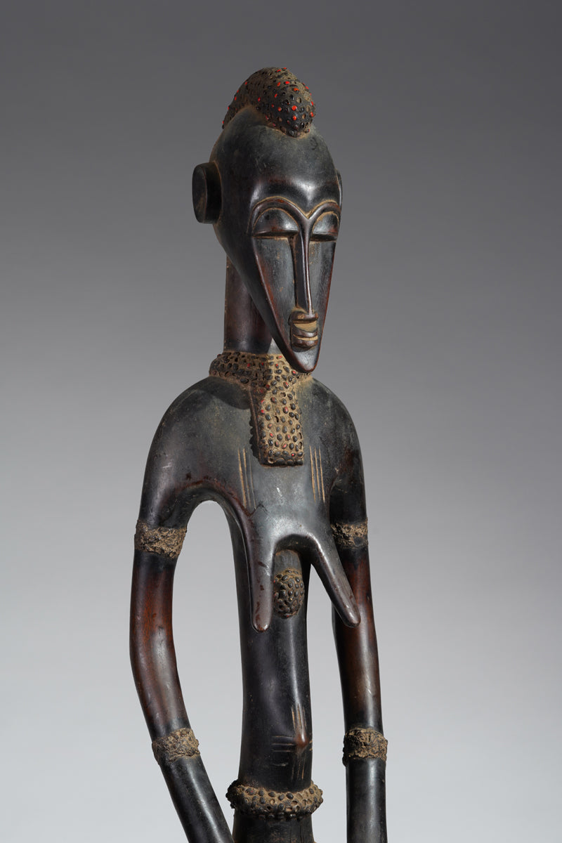 A female Senufo Rhythm pounder