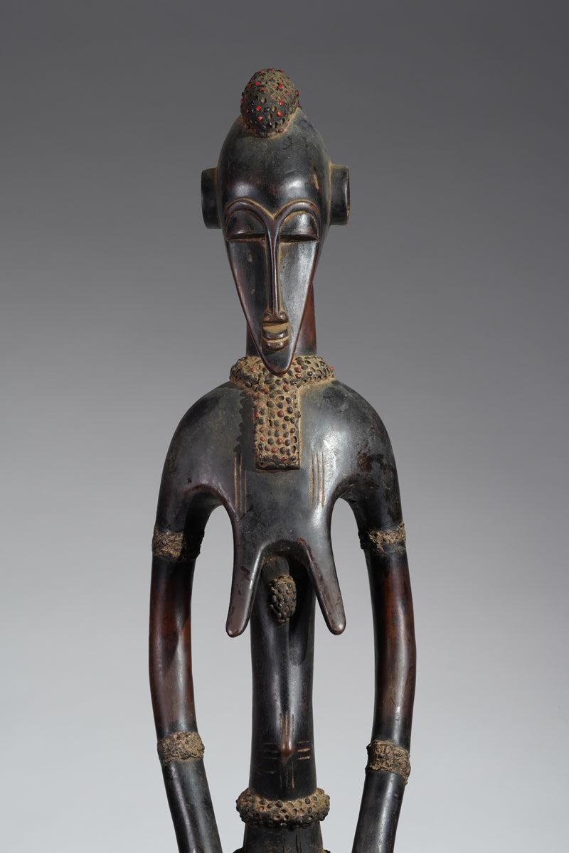 A female Senufo Rhythm pounder