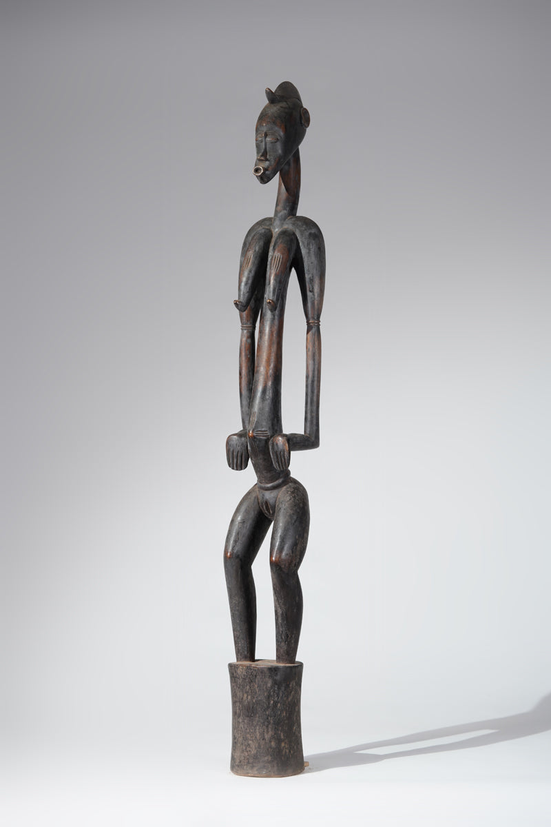 A female Senufo Rhythm pounder - called Débéle