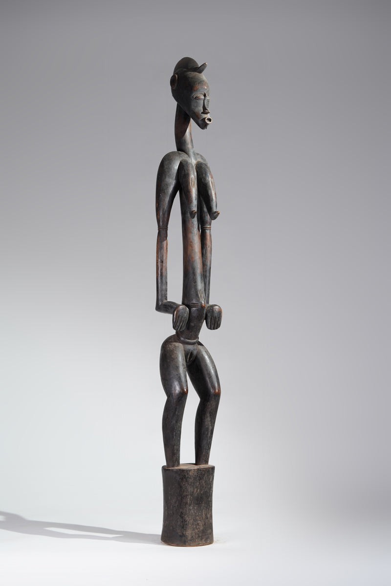 A female Senufo Rhythm pounder - called Débéle