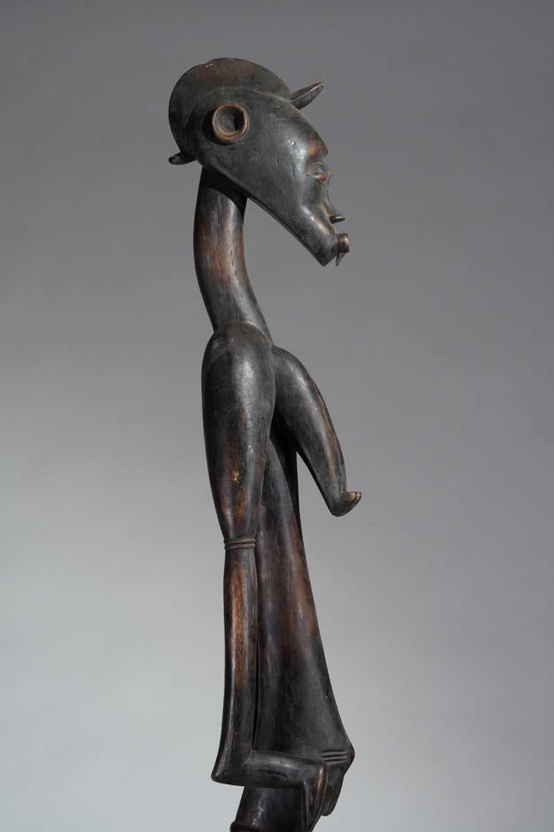 A female Senufo Rhythm pounder - called Débéle