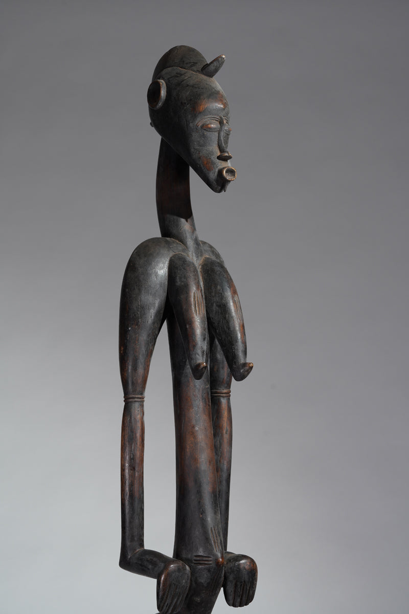 A female Senufo Rhythm pounder - called Débéle