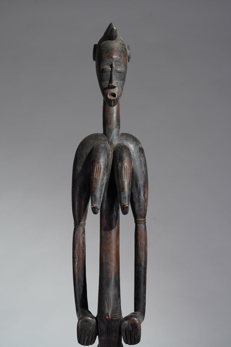 A female Senufo Rhythm pounder - called Débéle
