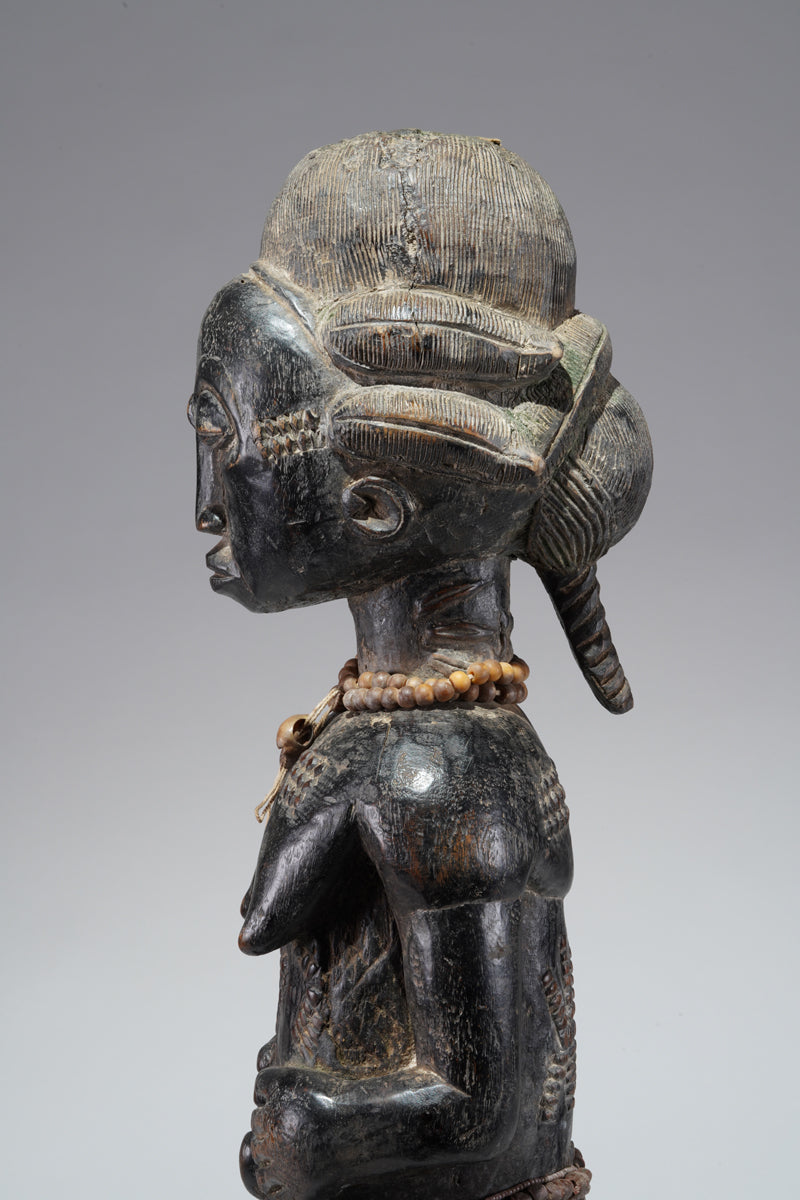 A female Baule figure