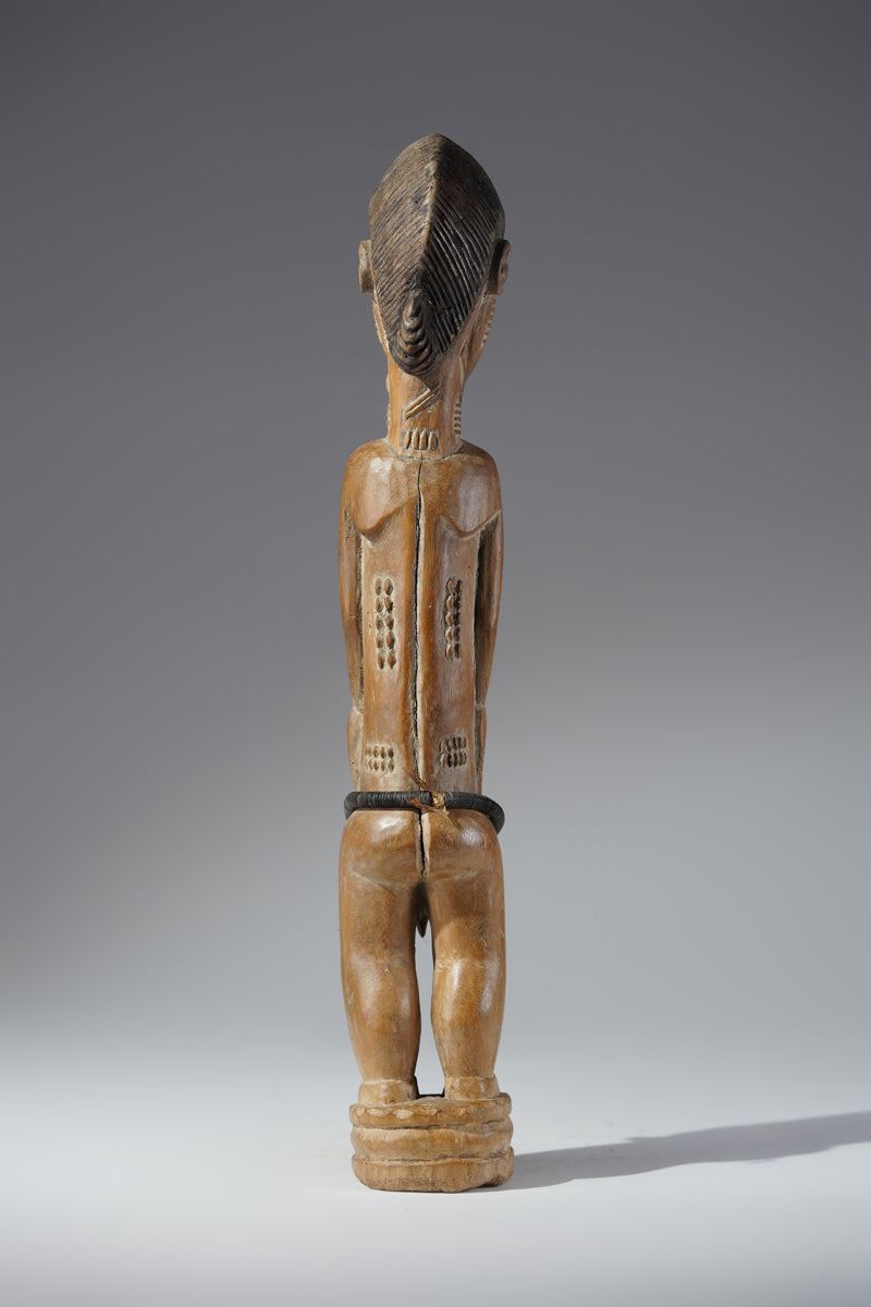 A Baule male sculpture