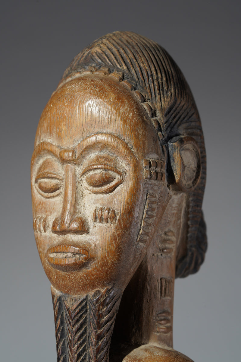 A Baule male sculpture