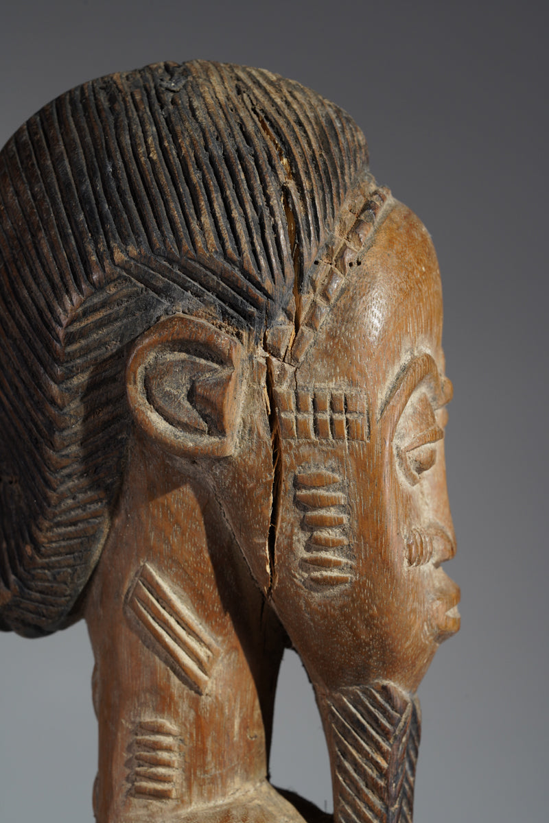 A Baule male sculpture