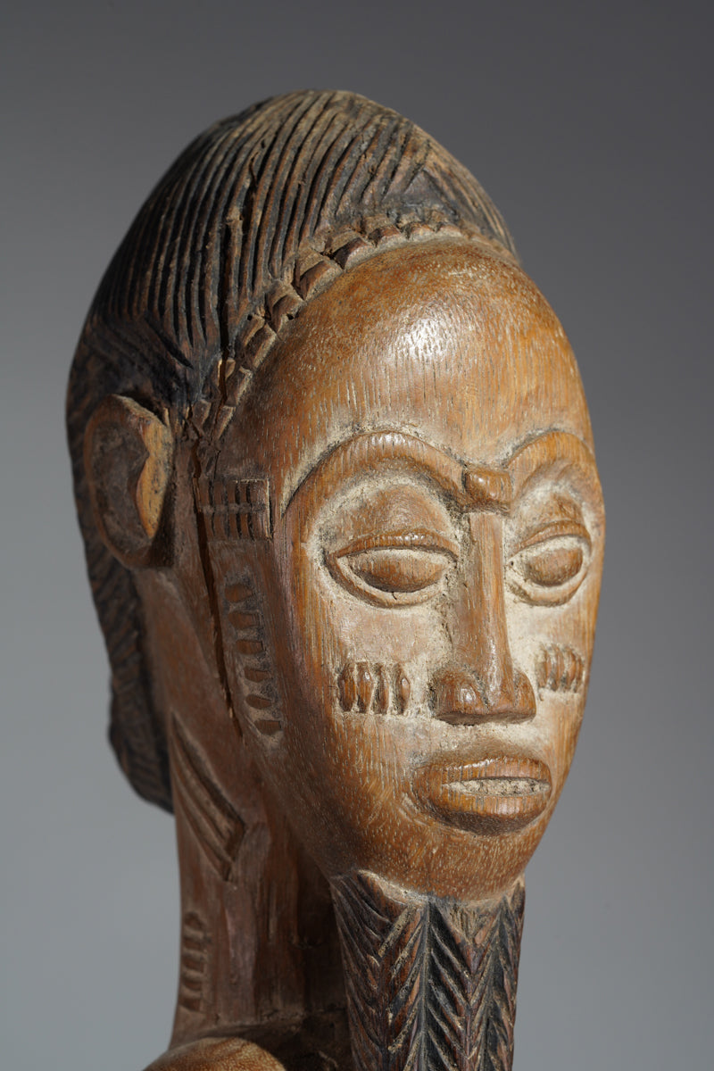 A Baule male sculpture