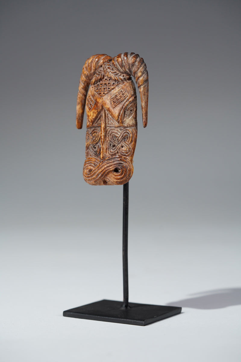 A Benin bone pendant