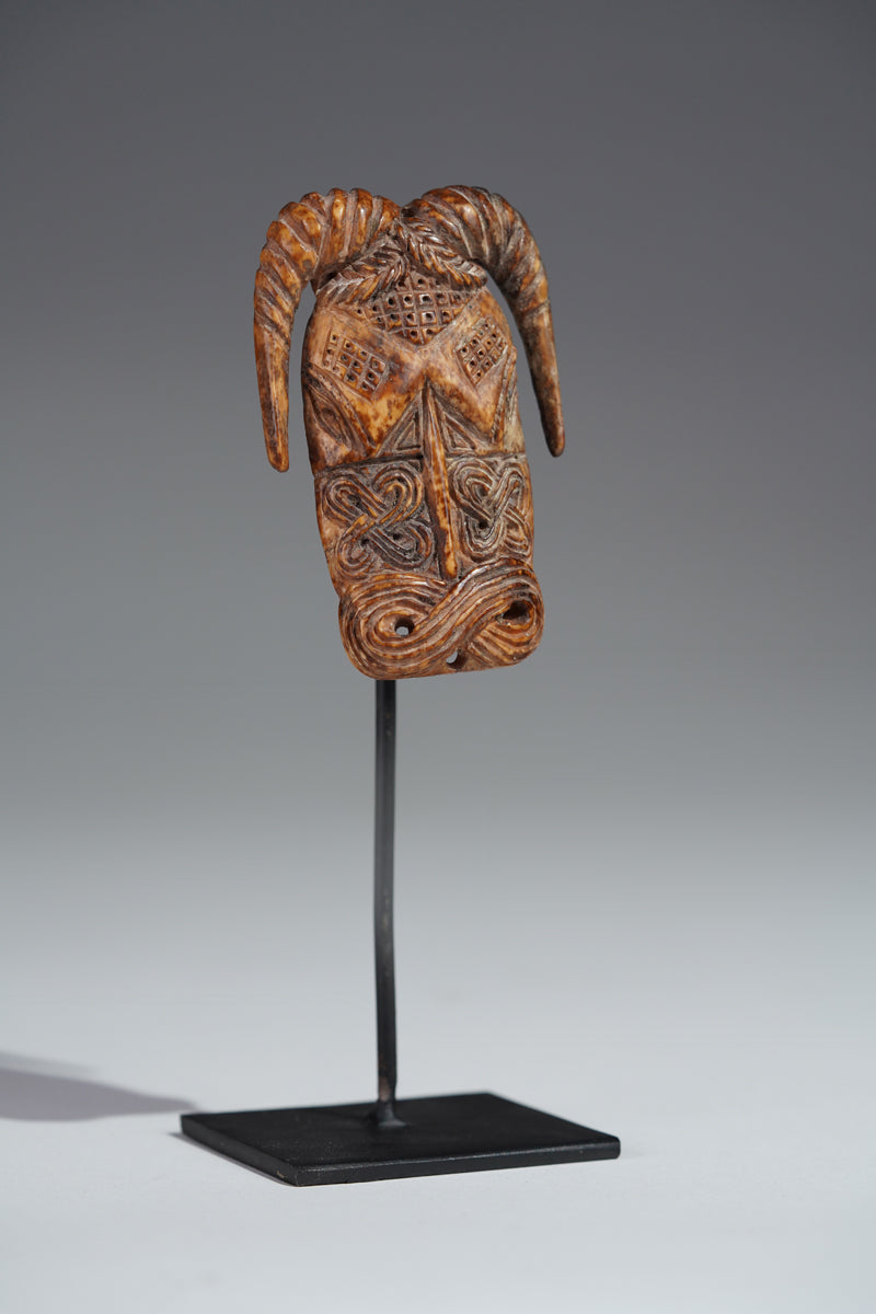 A Benin bone pendant