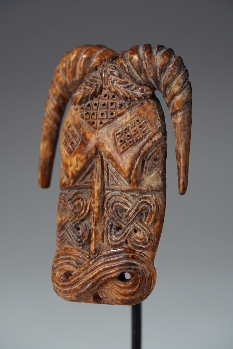 A Benin bone pendant