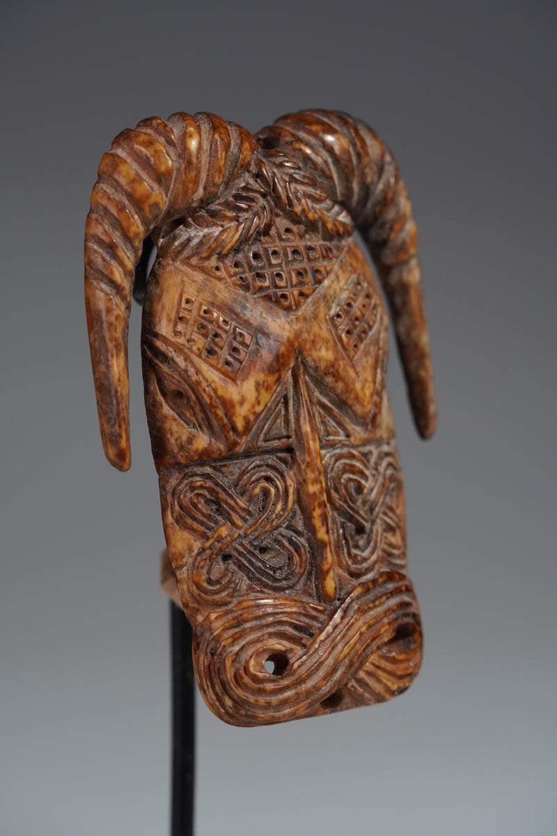 A Benin bone pendant