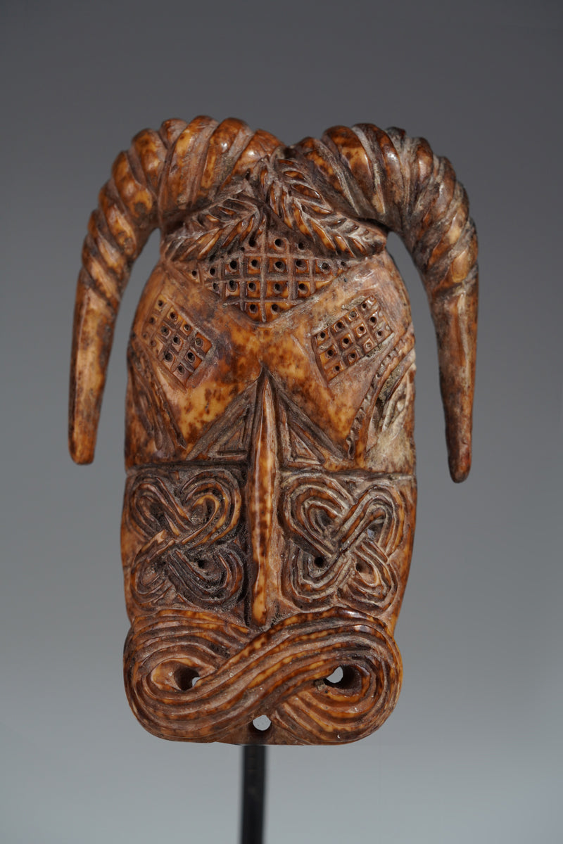 A Benin bone pendant