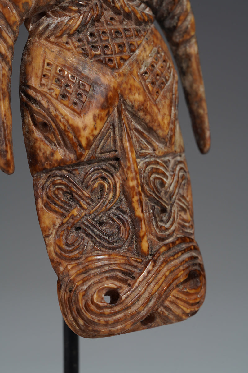 A Benin bone pendant