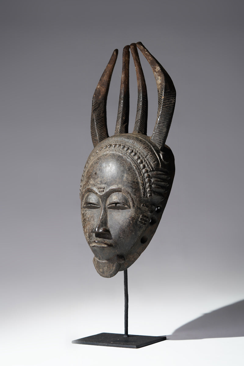 A horned Baule mask