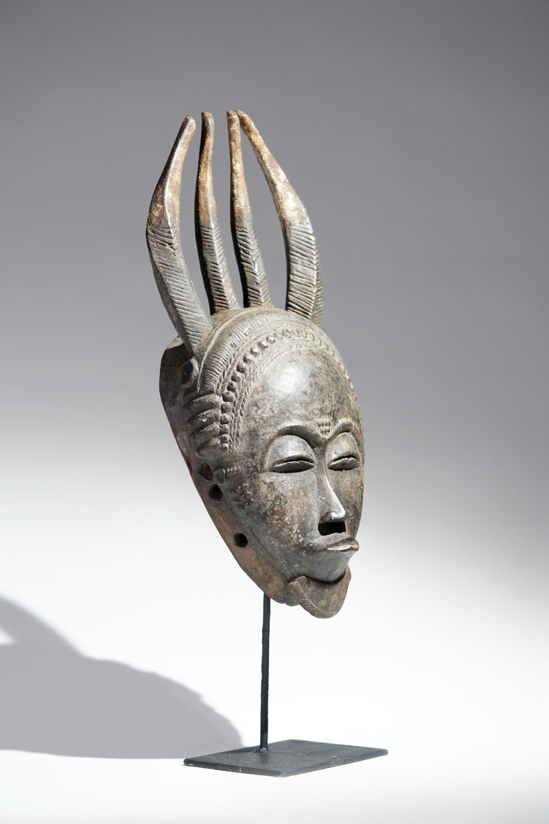 A horned Baule mask