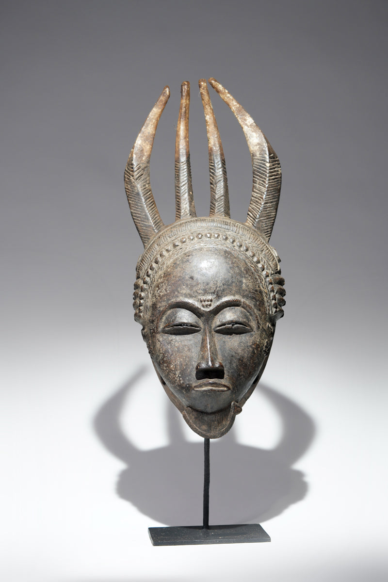 A horned Baule mask