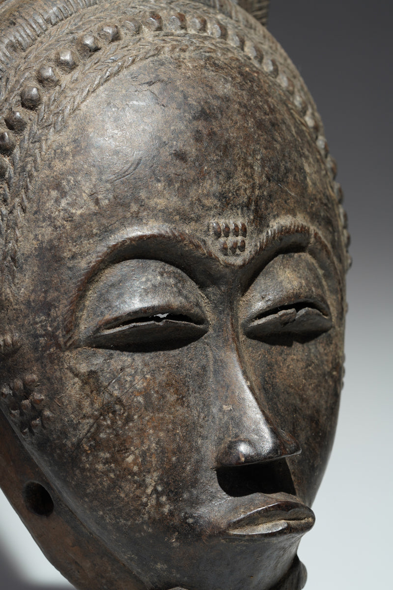 A horned Baule mask