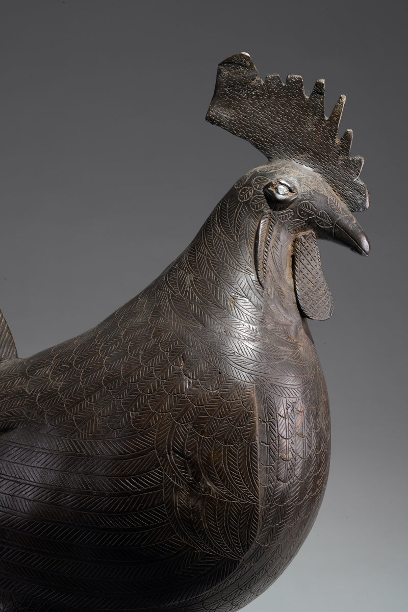 A brass rooster in the style of Benin, Ọkpa