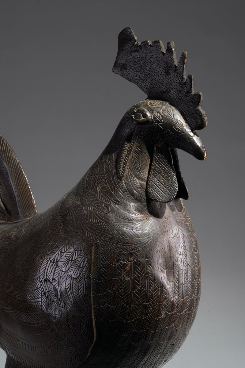 A brass rooster in the style of Benin, Ọkpa