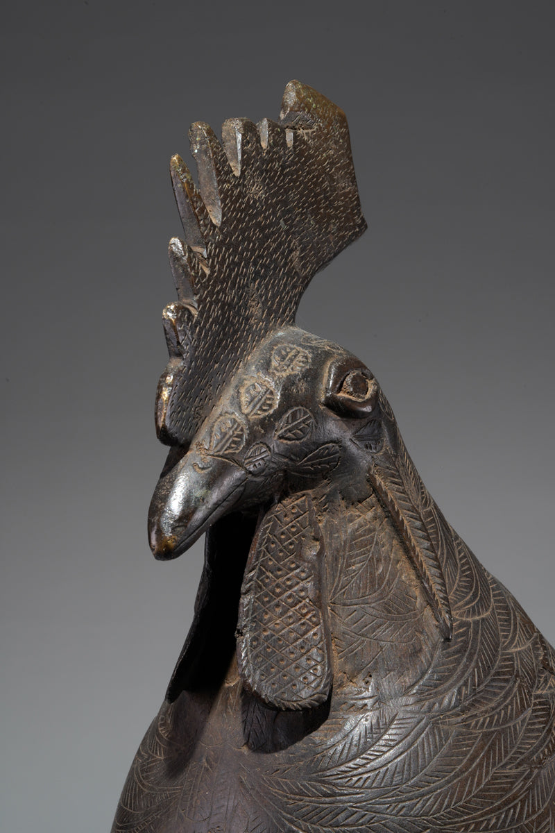 A brass rooster in the style of Benin, Ọkpa