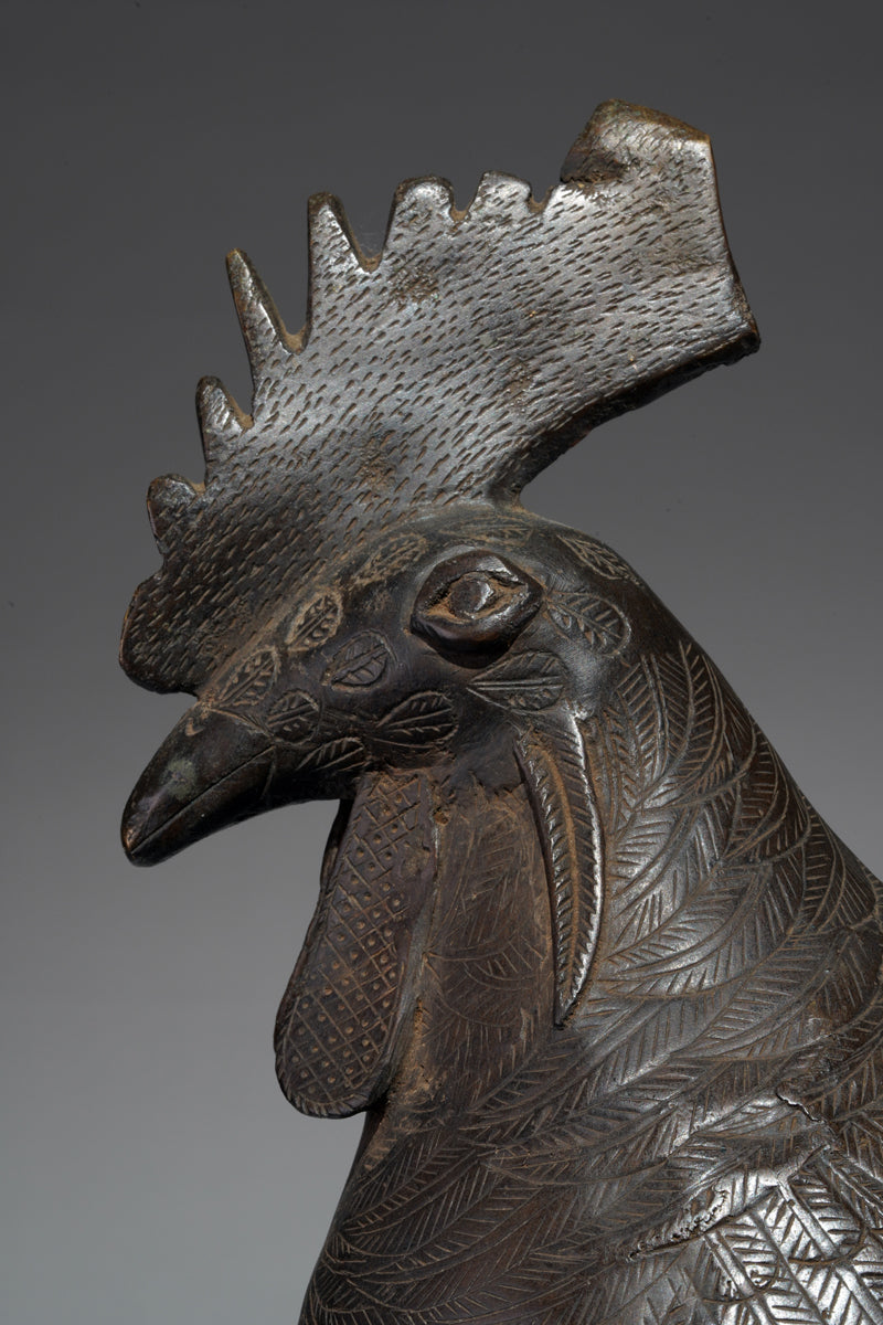 A brass rooster in the style of Benin, Ọkpa