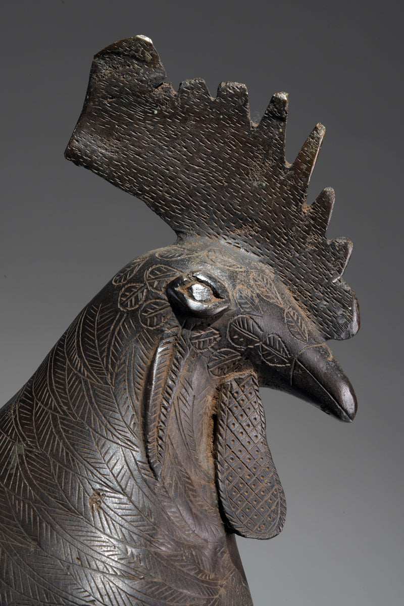 A brass rooster in the style of Benin, Ọkpa