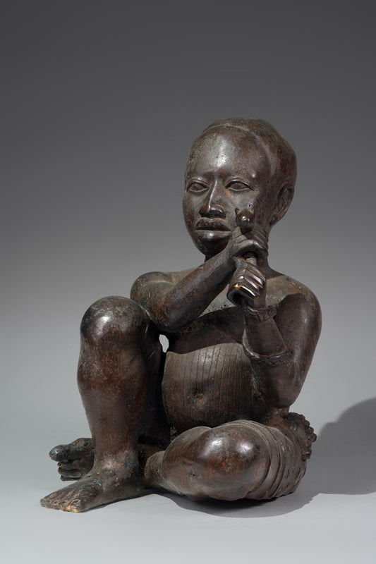 An Ife style bronze of the seated figure of Tada