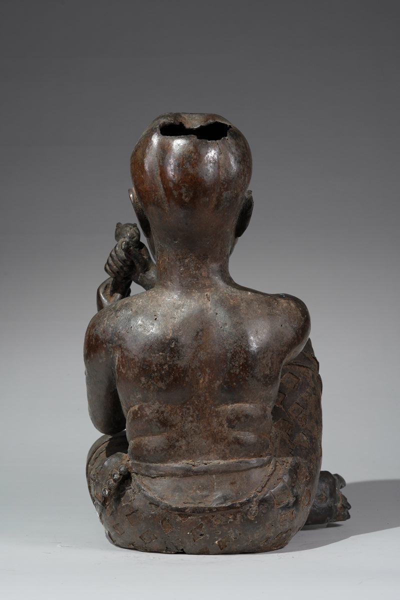 An Ife style bronze of the seated figure of Tada