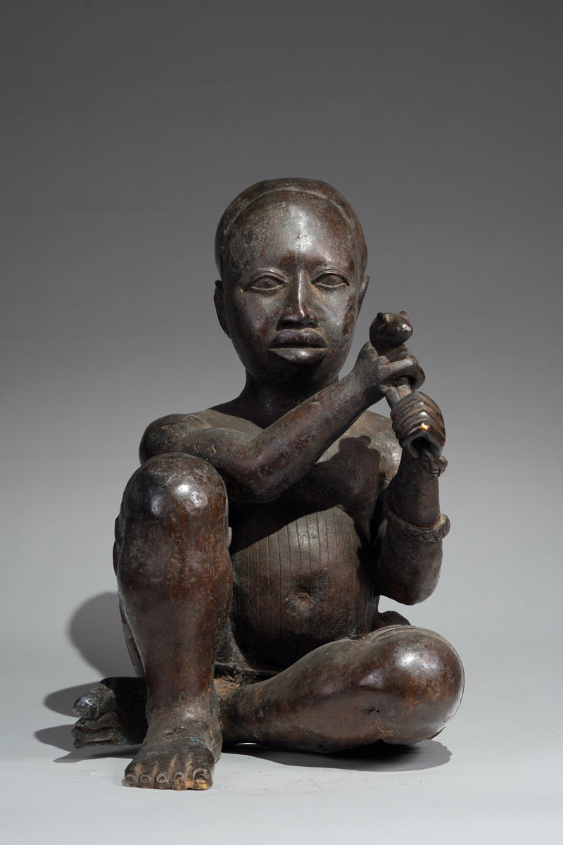 An Ife style bronze of the seated figure of Tada
