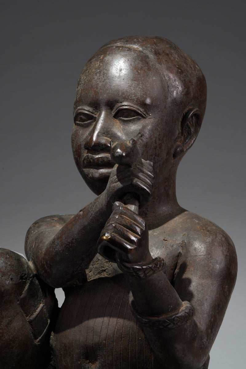 An Ife style bronze of the seated figure of Tada